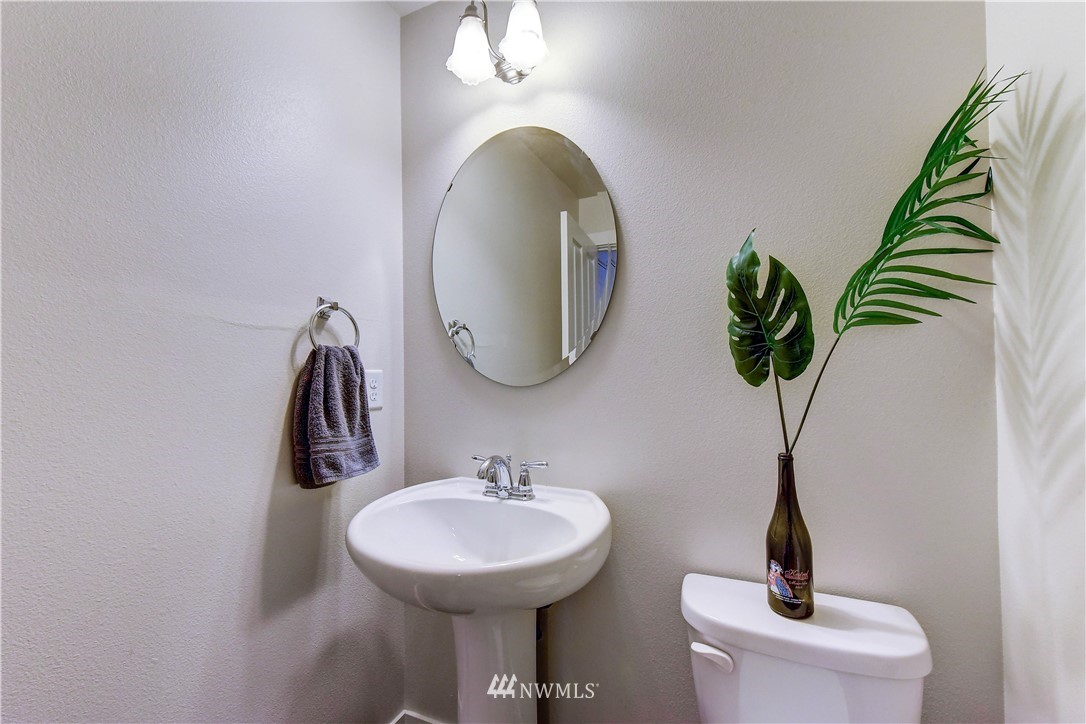 22330 35th Drive Southeast Bothell, WA 98021 - Photo 20 of 25 a bathroom with a toilet sink and mirror