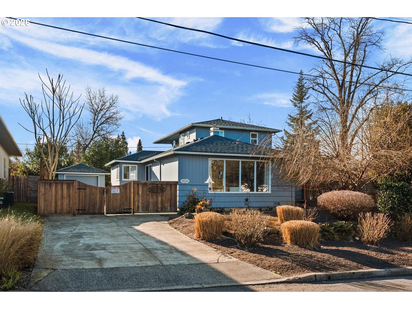 a front view of house with yard outdoor seating and barbeque oven