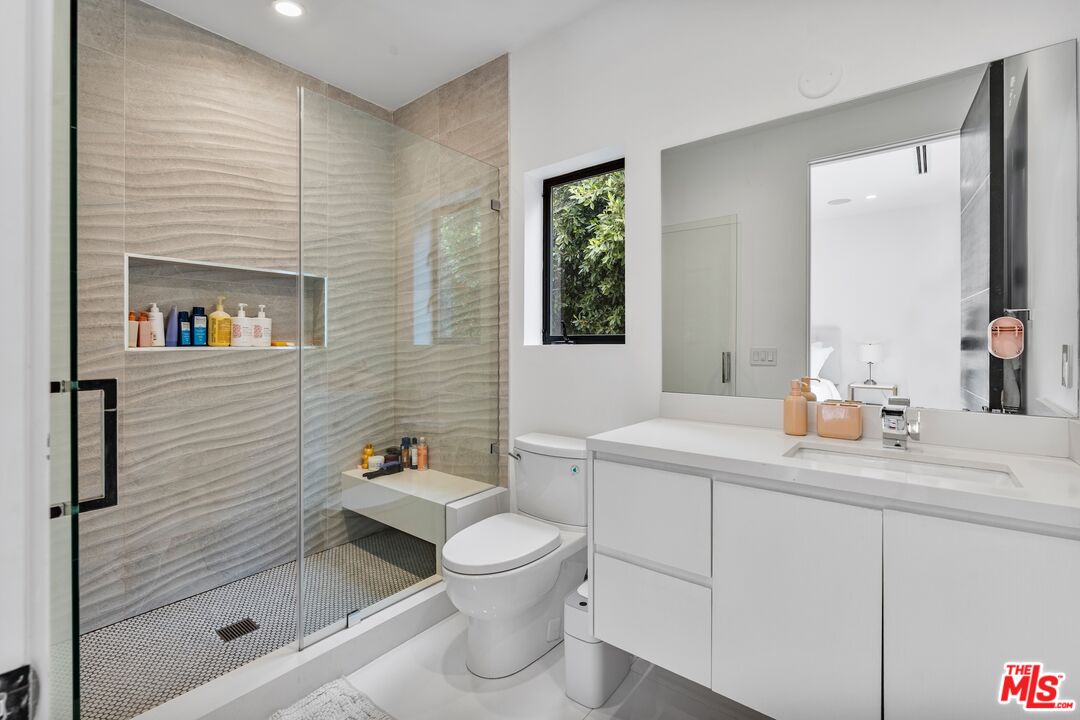3553 Alana Drive Sherman Oaks, CA 91403 - Photo 17 of 35 a bathroom with a sink a toilet and shower