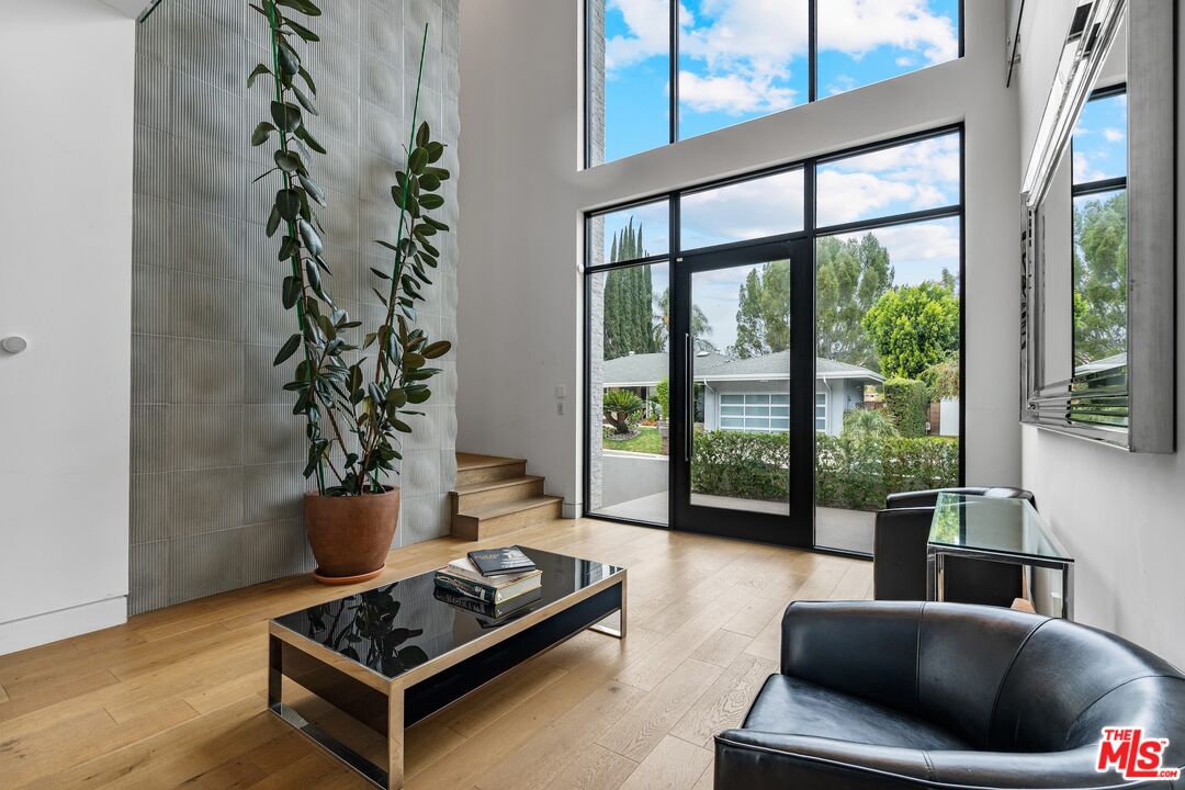 3553 Alana Drive Sherman Oaks, CA 91403 - Photo 2 of 35 a living room with furniture and a potted plant