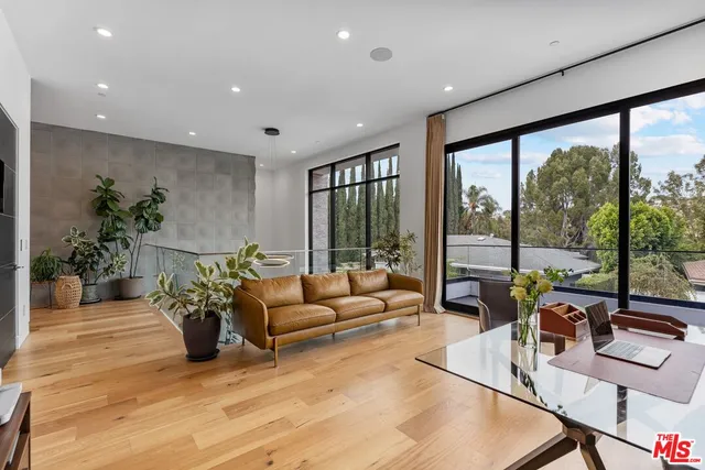 a living room with furniture large window with outer view