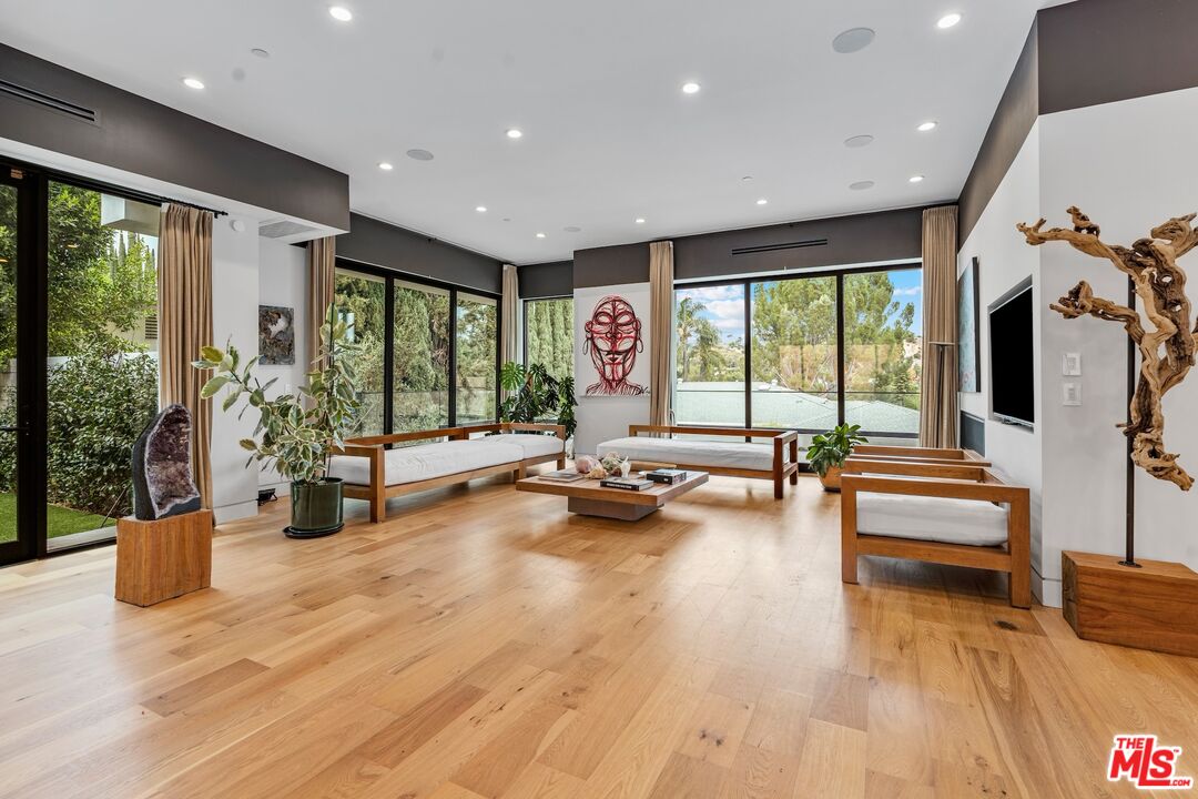 3553 Alana Drive Sherman Oaks, CA 91403 - Photo 6 of 35 a view of a gym with large windows and wooden floor