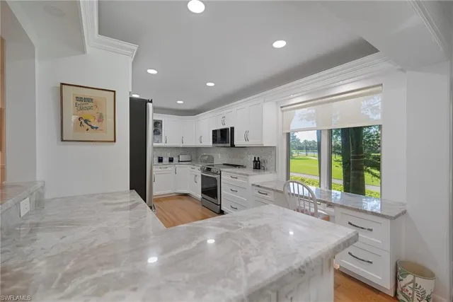 $735,000 | 104 Wilderness Drive, Unit 241, Naples, FL 34105