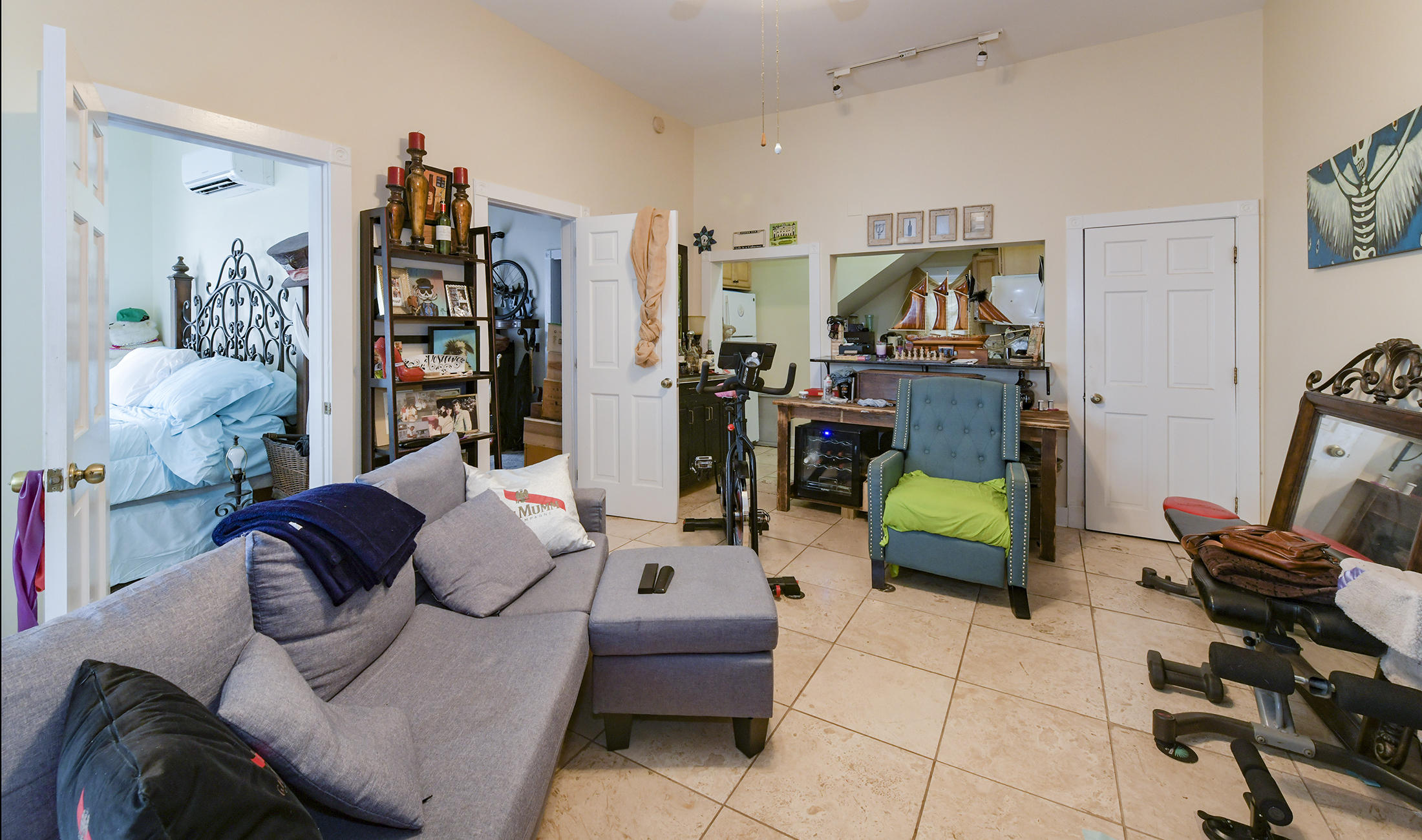 419 William Street, Unit 3 Key West, FL 33040 - Photo 3 of 12 a living room with furniture and a book shelf