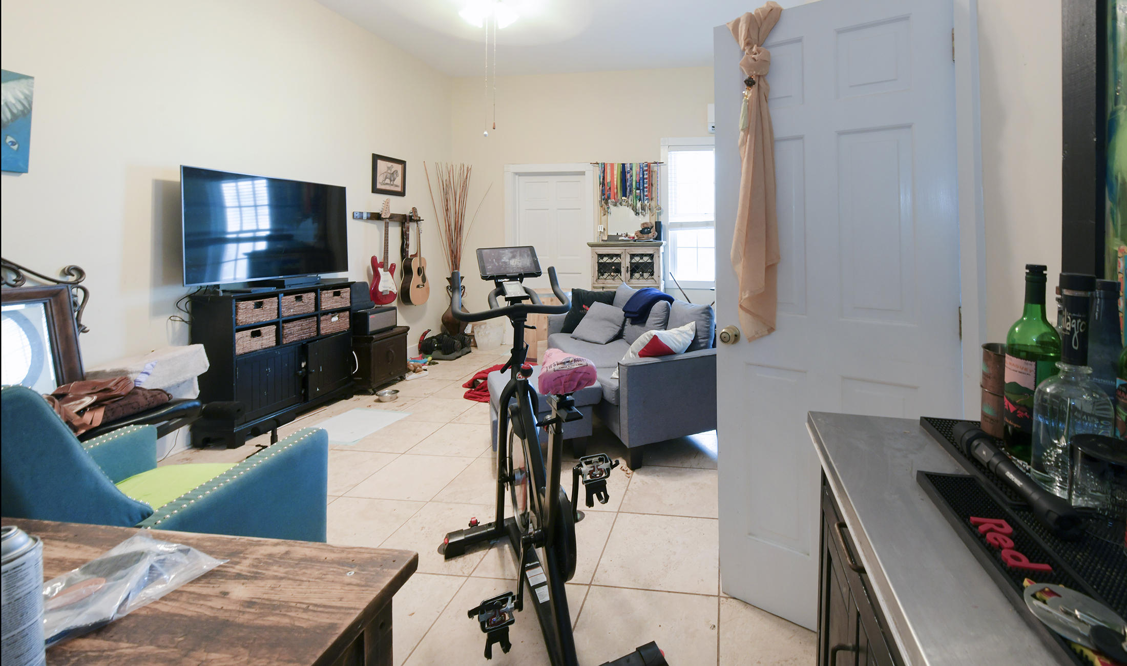 419 William Street, Unit 3 Key West, FL 33040 - Photo 4 of 12 a living room with furniture and a flat screen tv