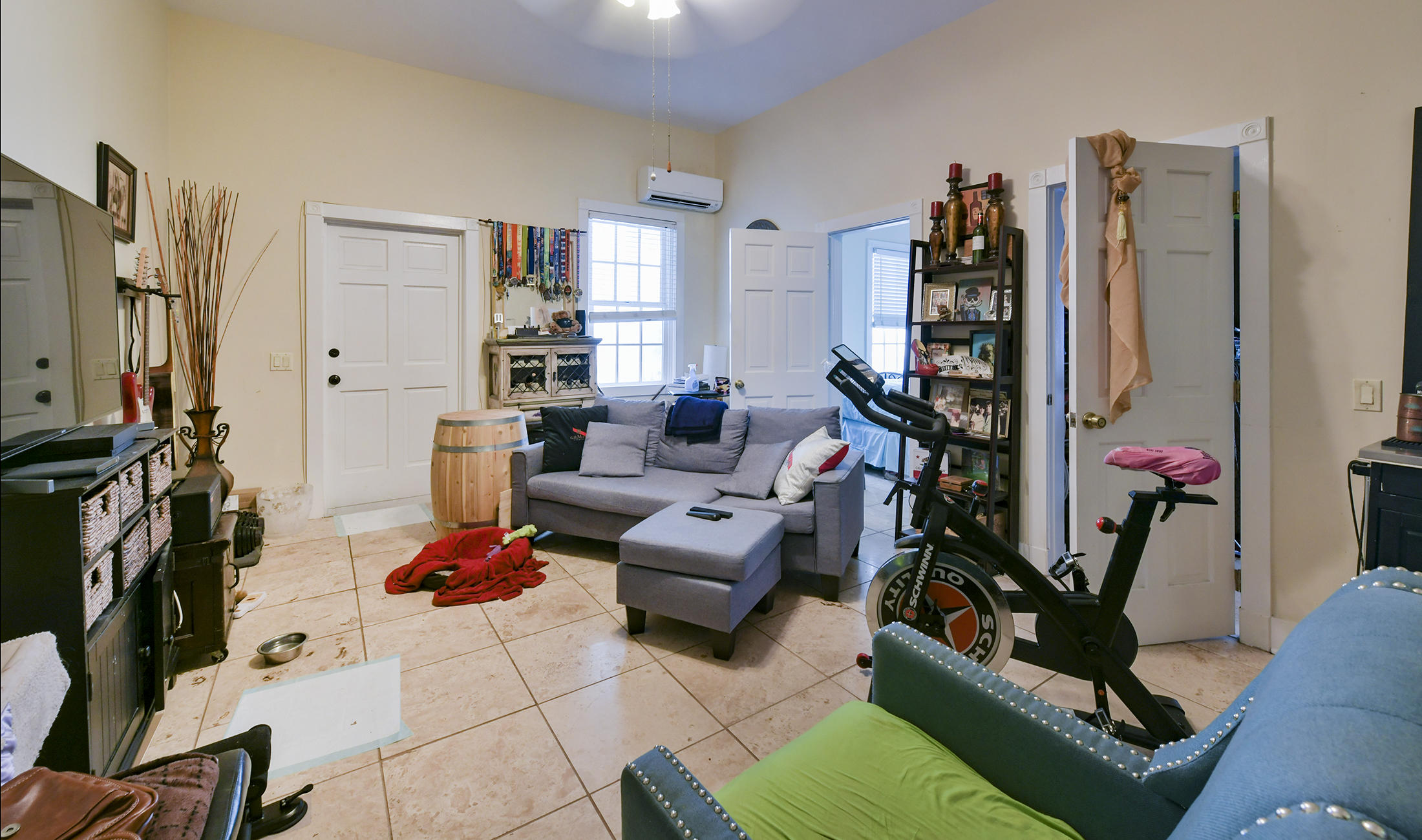 419 William Street, Unit 3 Key West, FL 33040 - Photo 5 of 12 a living room with furniture a flat screen tv and a table