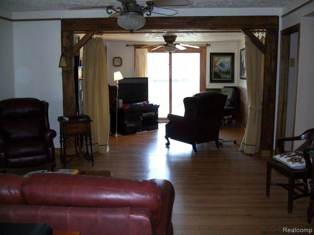 1416 Faussett Road Howell, MI 48855 - Photo 7 of 13 Living Room into Sitting Room - views of Mill Pond.jpg