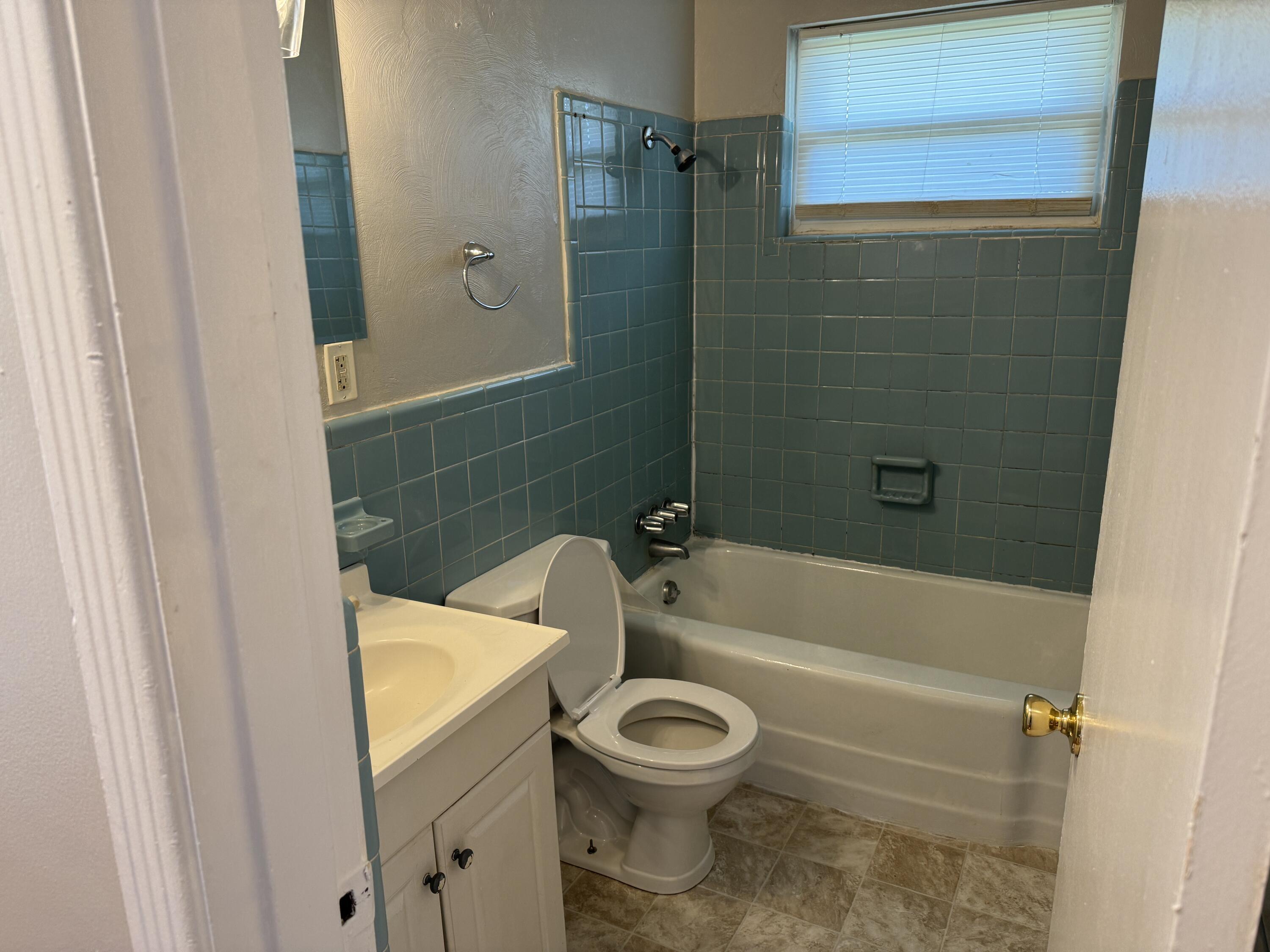 357 Terry Avenue Danville, VA 24540 - Photo 8 of 8 a bathroom with a toilet and a bathtub
