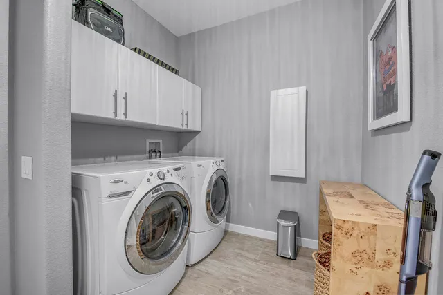 a large bed sitting in a bedroom next to a window