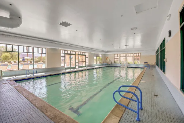 a living room with lots of furniture and white walls