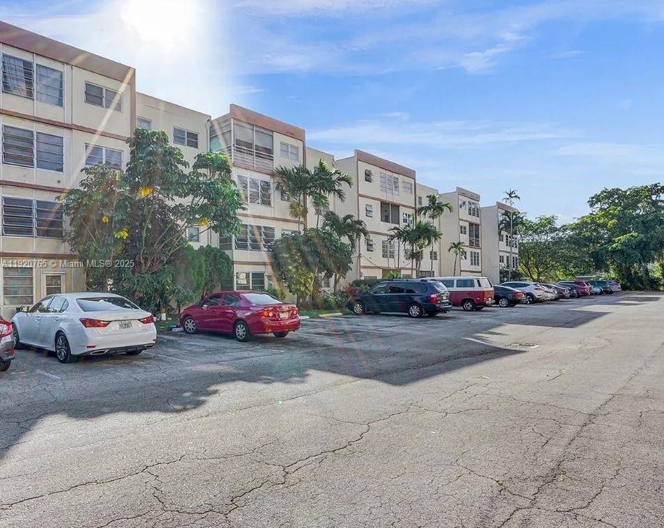 4047 Northwest 16th Street, Unit 403 Lauderhill, FL 33313 - Photo 10 of 30 a view of street with cars