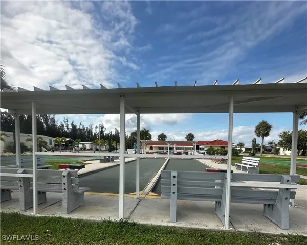 a view of a chairs and table in the patio