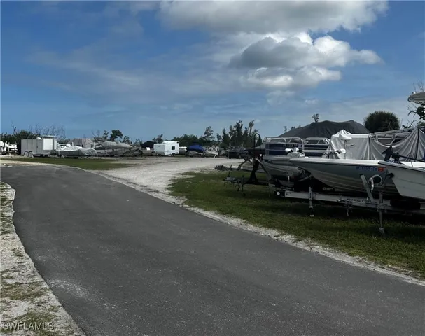 a view of a street with a tree in front of it