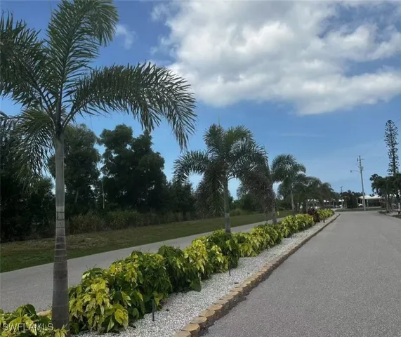 a view of lake with green space