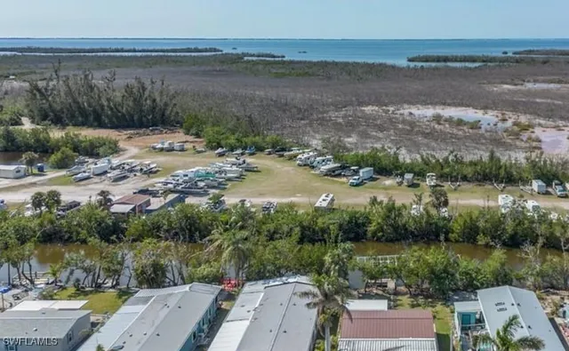 a sign broad in front of red brick house
