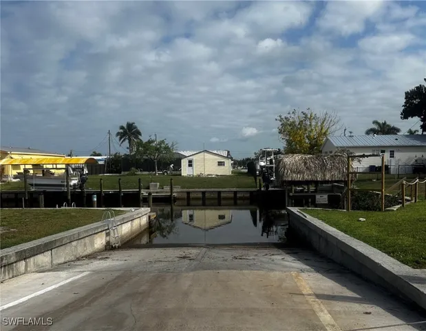 a swimming pool with outdoor seating and yard