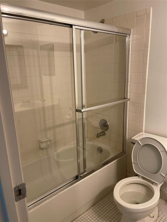 8405 Northwest 61st Street, Unit D109 Tamarac, FL 33321 - Photo 13 of 25 a bathroom with a toilet and a shower