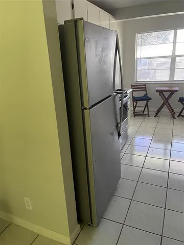 a view of a dining room with furniture and window