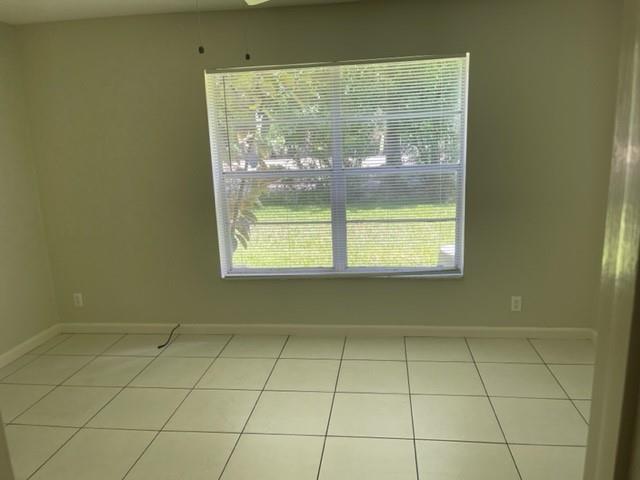 8405 Northwest 61st Street, Unit D109 Tamarac, FL 33321 - Photo 21 of 25 a view of a room that has a window in it