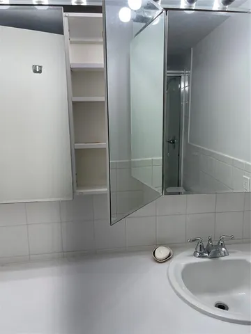 a bathroom with a sink and mirror