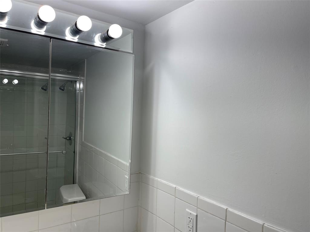 8405 Northwest 61st Street, Unit D109 Tamarac, FL 33321 - Photo 10 of 25 a bathroom with a shower