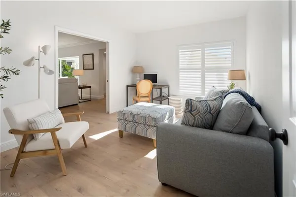 a living room with furniture and a window