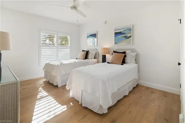 a bedroom with bed and a window