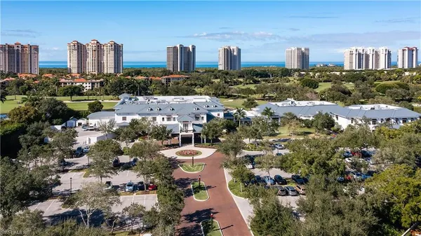 a view of a patio with table and chairs