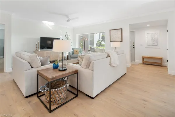 a living room with furniture and a table