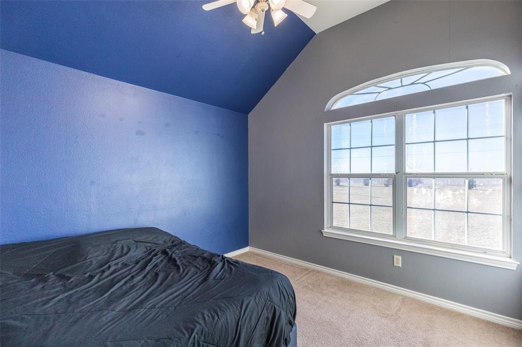 2166 County Road 131 Tuscola, TX 79562 - Photo 19 of 40 a bedroom with a bed and a window