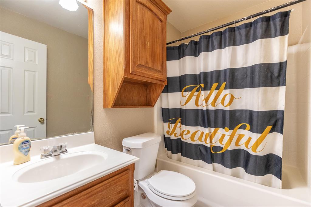 2166 County Road 131 Tuscola, TX 79562 - Photo 21 of 40 a bathroom with a sink and a toilet