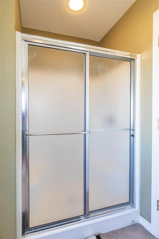 2166 County Road 131 Tuscola, TX 79562 - Photo 31 of 40 a bathroom with a glass shower door