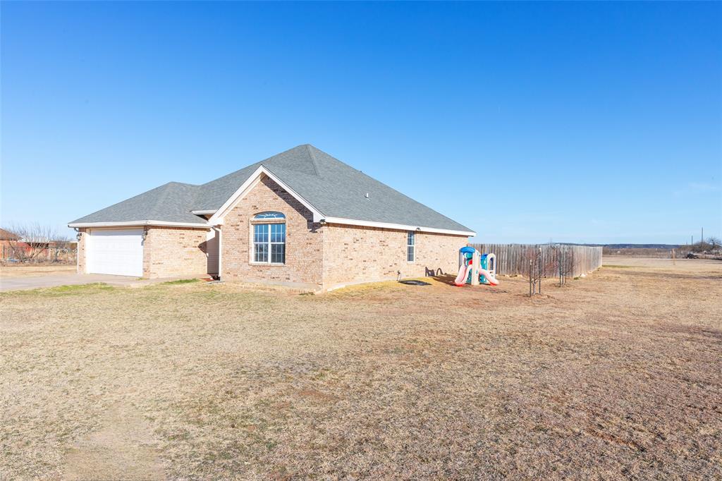 2166 County Road 131 Tuscola, TX 79562 - Photo 4 of 40 a house with a yard