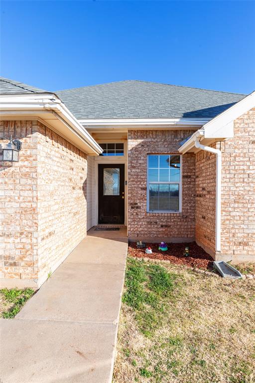 2166 County Road 131 Tuscola, TX 79562 - Photo 5 of 40 a front view of a house with a yard