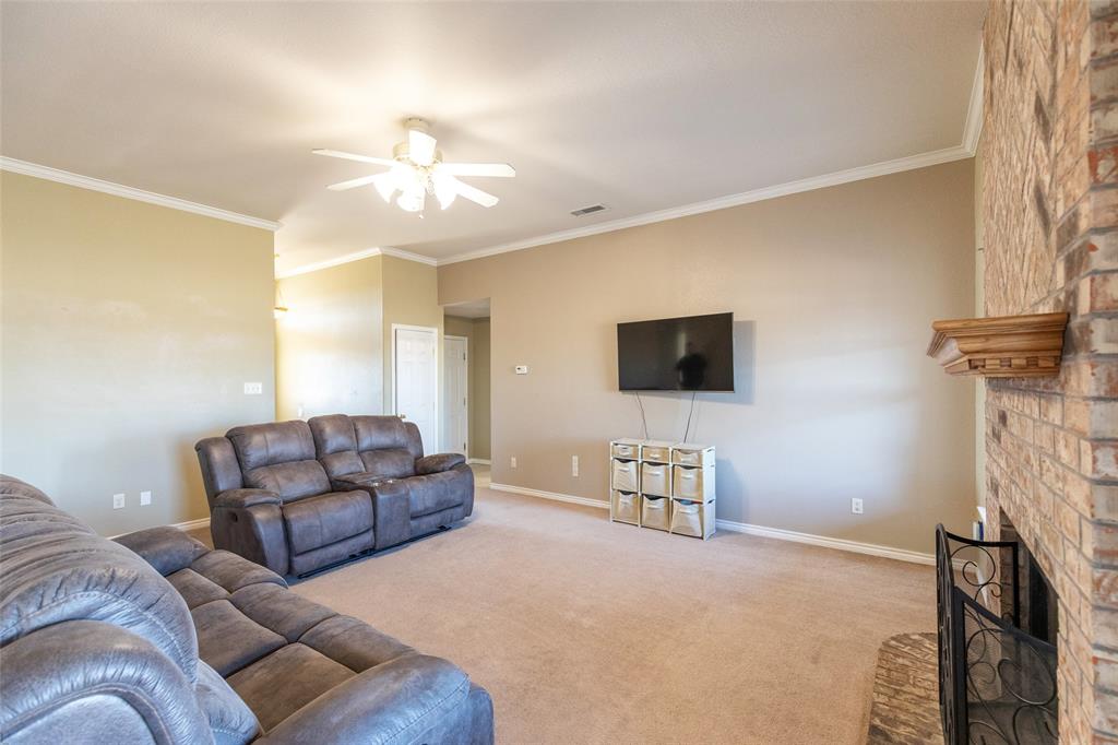2166 County Road 131 Tuscola, TX 79562 - Photo 10 of 40 a living room with furniture and a flat screen tv