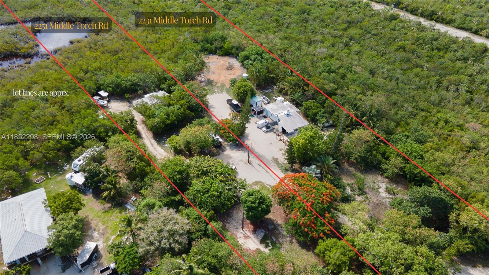 2231 Middle Torch Road Summerland Key, FL 33042 - Photo 11 of 36 an aerial view of residential house with outdoor space and trees all around