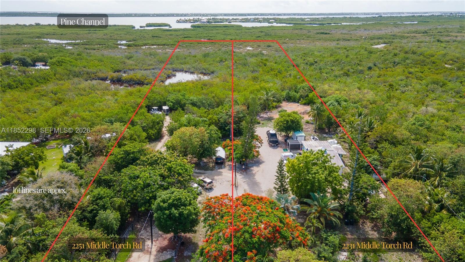 2231 Middle Torch Road Summerland Key, FL 33042 - Photo 14 of 36 a view of a city with tall trees