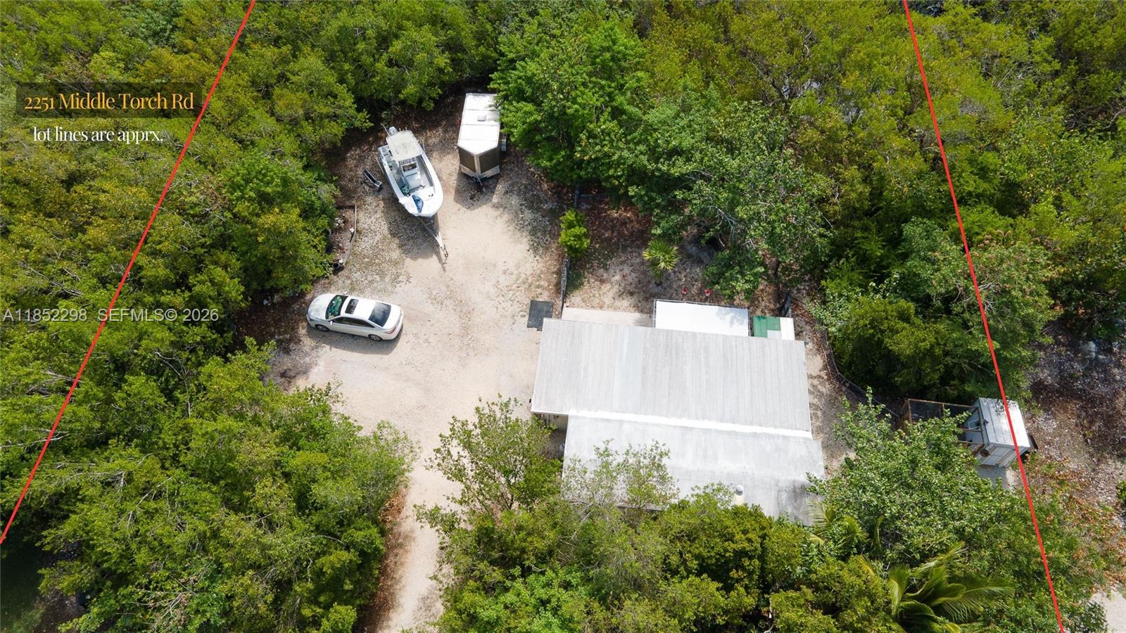 2231 Middle Torch Road Summerland Key, FL 33042 - Photo 17 of 36 an aerial view of a house with outdoor space and trees all around