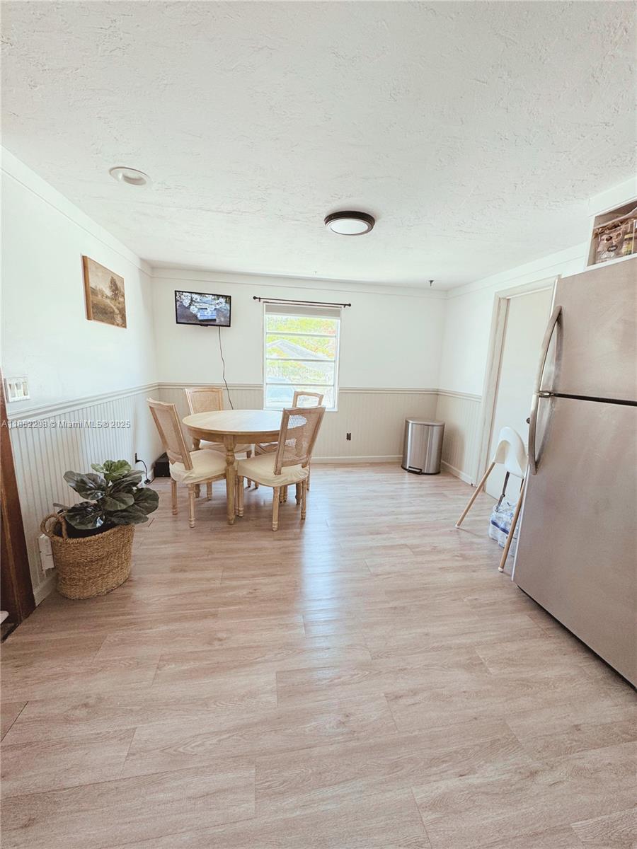 2231 Middle Torch Road Summerland Key, FL 33042 - Photo 24 of 33 a living room with furniture and a dining table with wooden floor