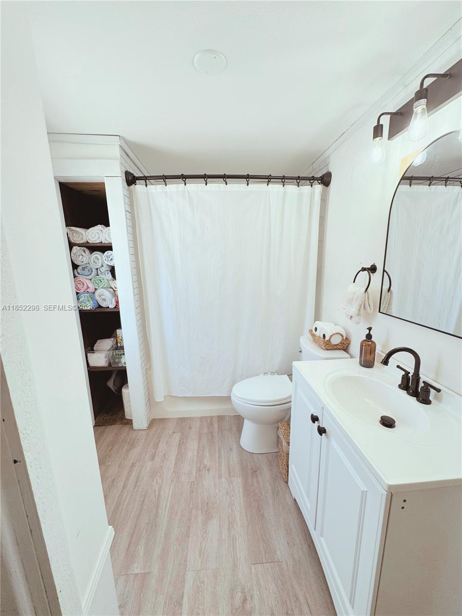 2231 Middle Torch Road Summerland Key, FL 33042 - Photo 28 of 36 a bathroom with a sink and mirror with toilet