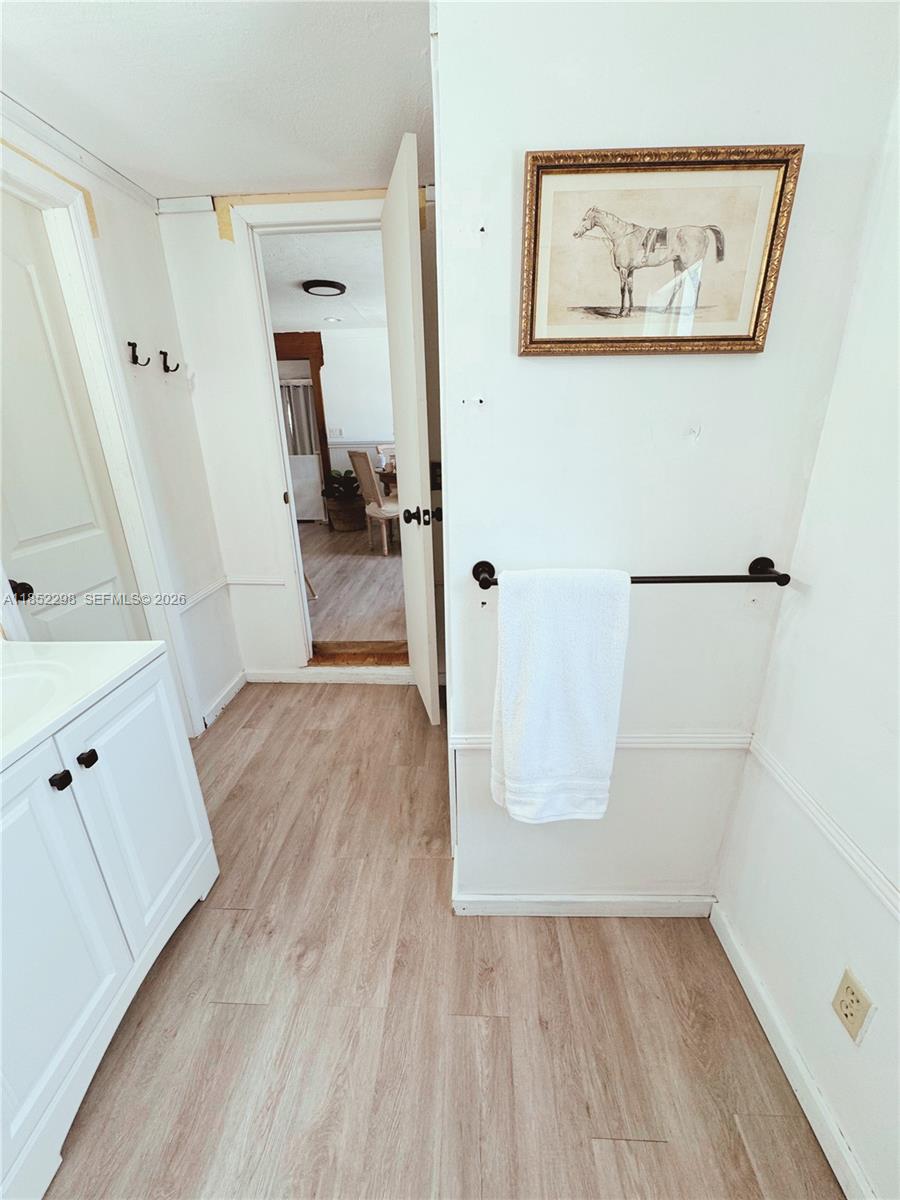 2231 Middle Torch Road Summerland Key, FL 33042 - Photo 29 of 36 an entryway view with wooden floor and cabinet