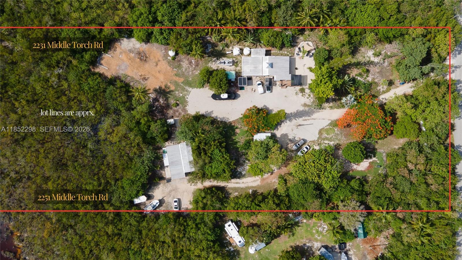 2231 Middle Torch Road Summerland Key, FL 33042 - Photo 9 of 36 an aerial view of a house with a yard and lake view