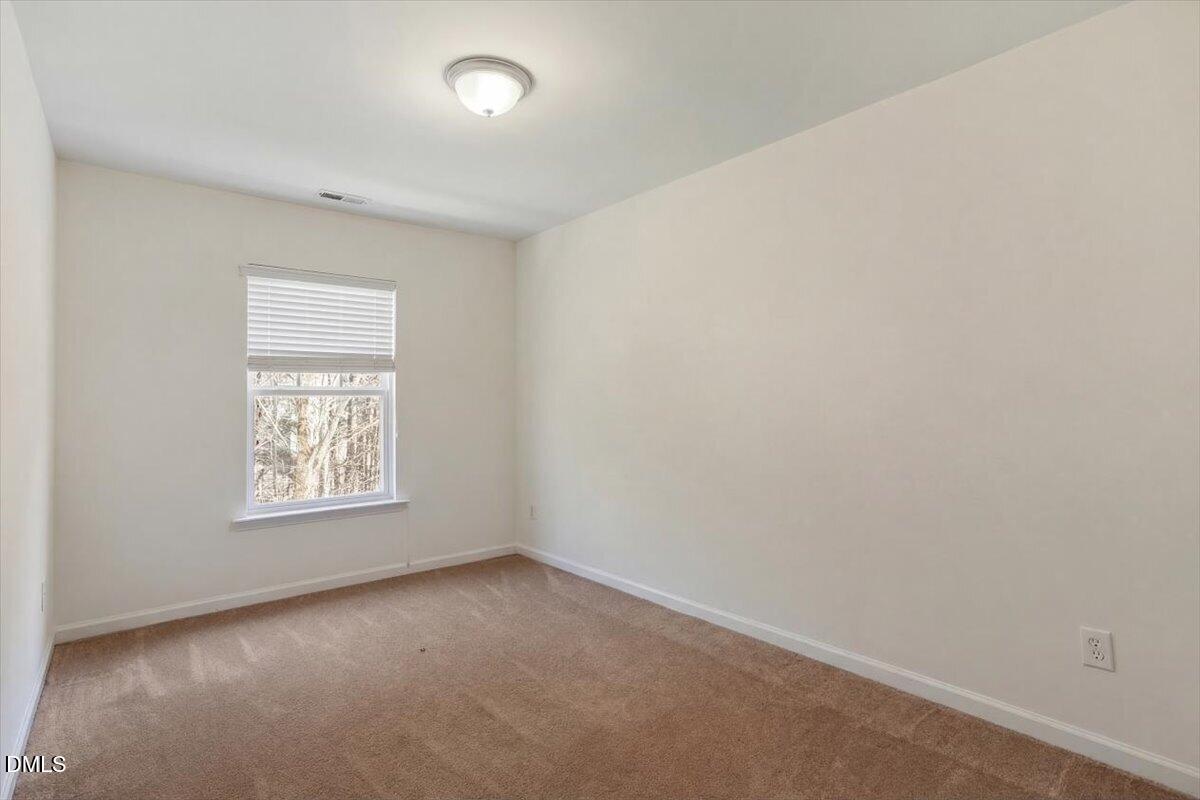 2231 Raven Road, Unit 103 Raleigh, NC 27614 - Photo 16 of 26 an empty room with windows