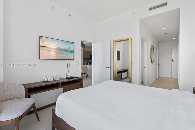 a bedroom with a bed and a table