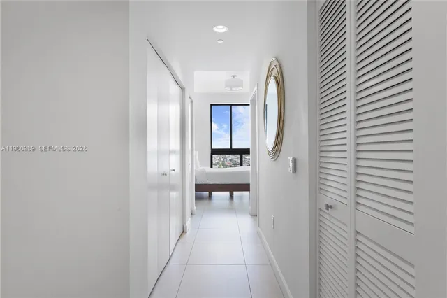 a view of a hallway with seating area