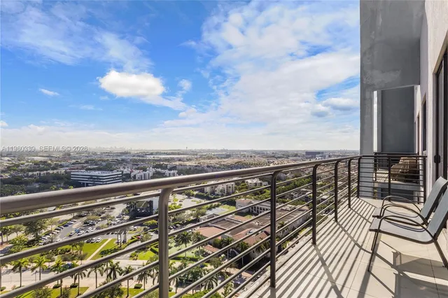 a view of balcony with furniture