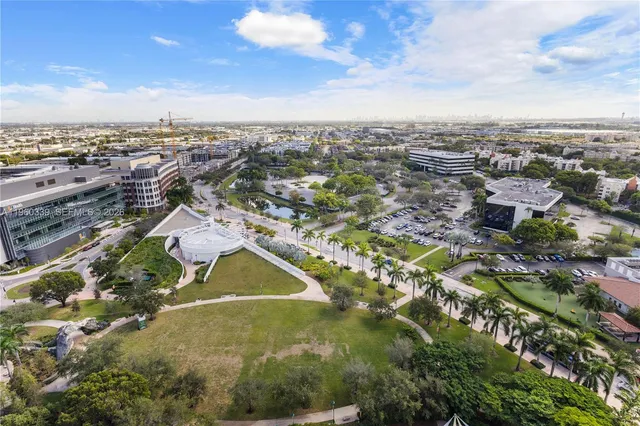 an aerial view of residential building with trees