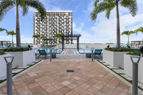 a view of a patio with a table and chairs