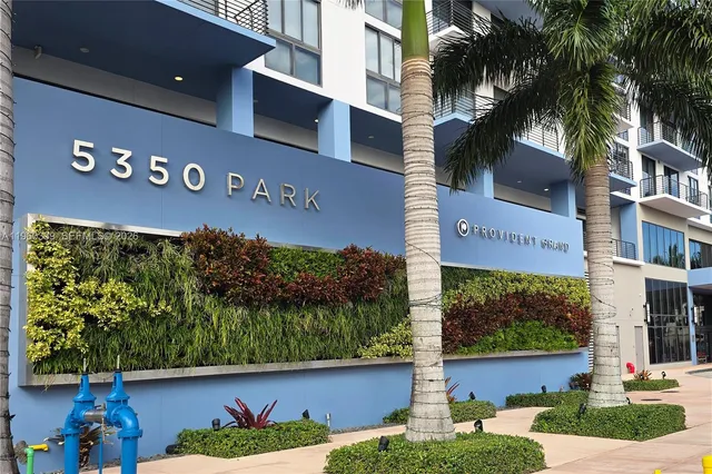a living room filled with furniture and a fireplace