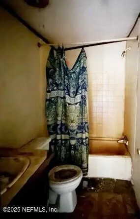 a bathroom with view of a city street